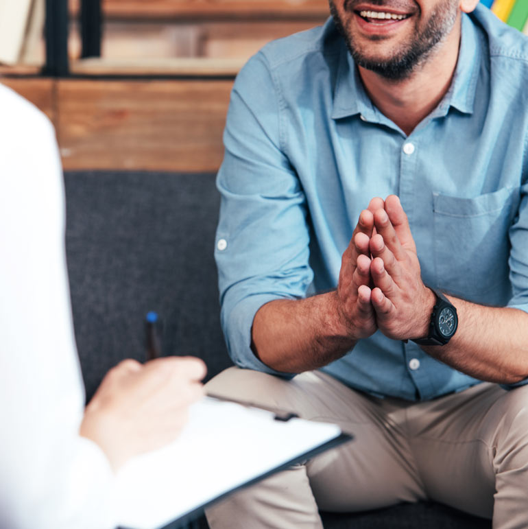 smiling man at therapist
